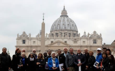 Members of the survivors' group Ending Clergy Abuse in front of St Peter's Square at the Vatican  - Credit: Gregorio Borgia/AP