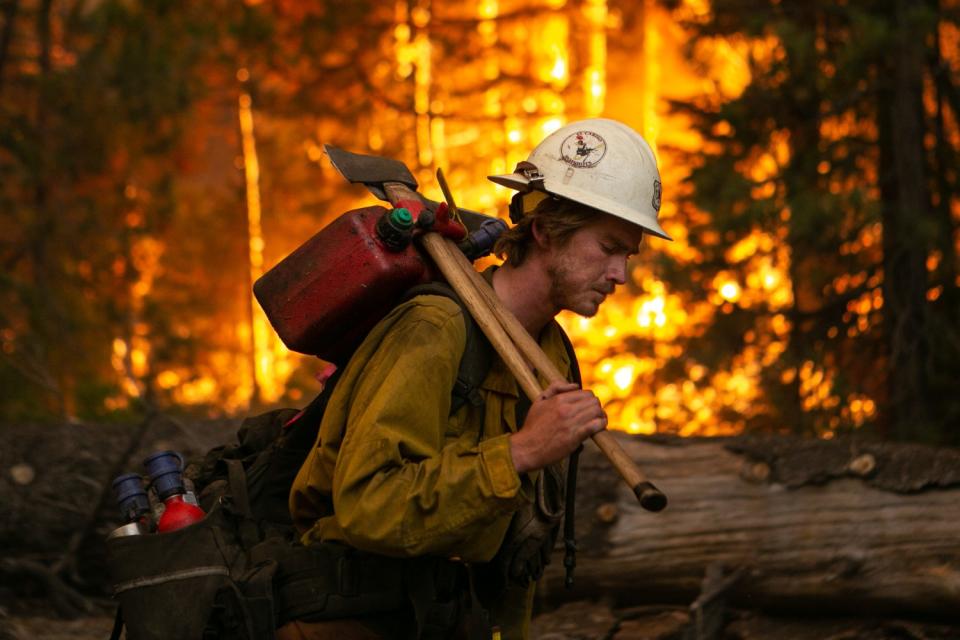 Firefighters work a control burn on Hwy. 50 in Strawberry.