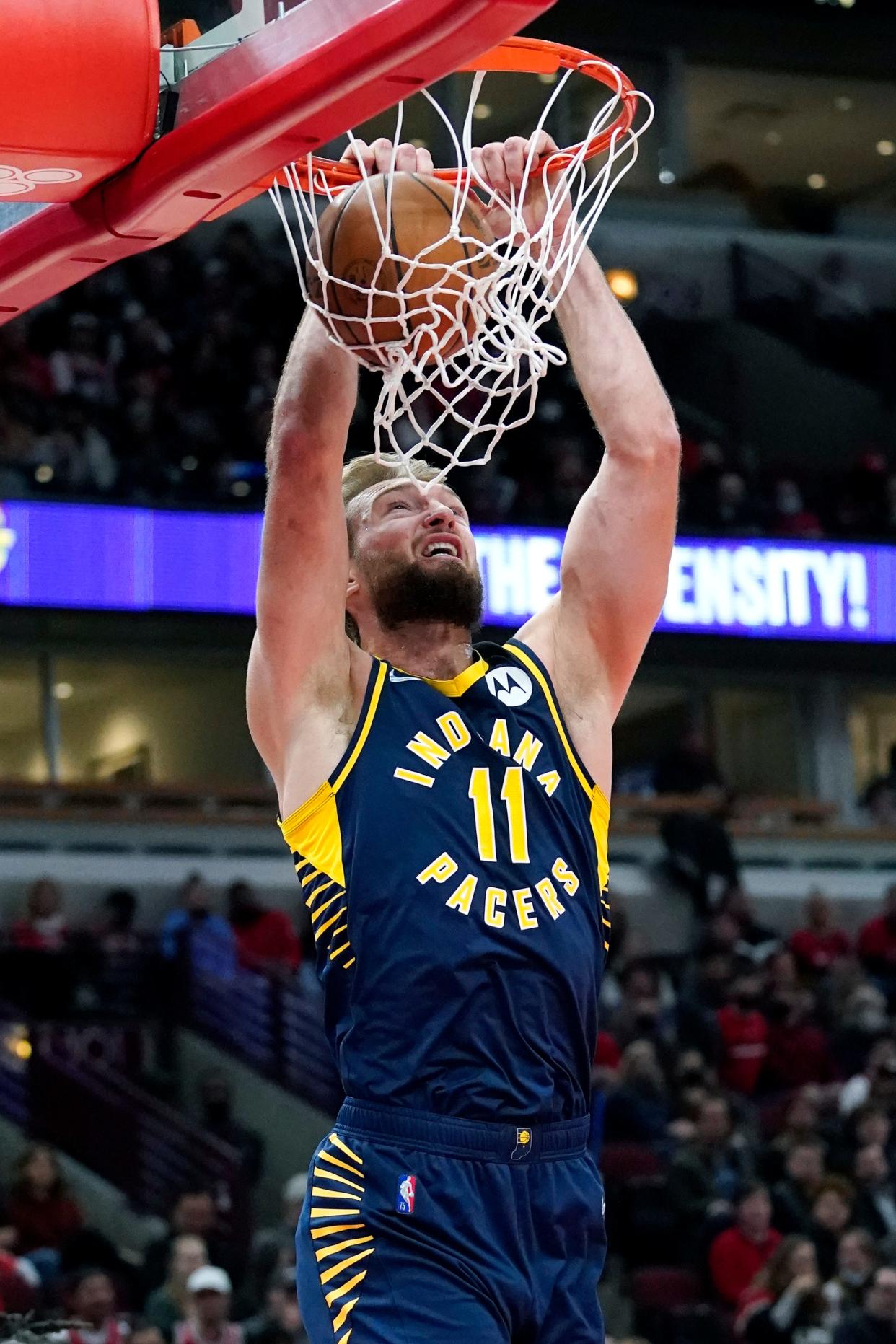 Indiana Pacers forward Domantas Sabonis dunks against the Chicago Bulls during the first half of an NBA basketball game in Chicago, Monday, Nov. 22, 2021.