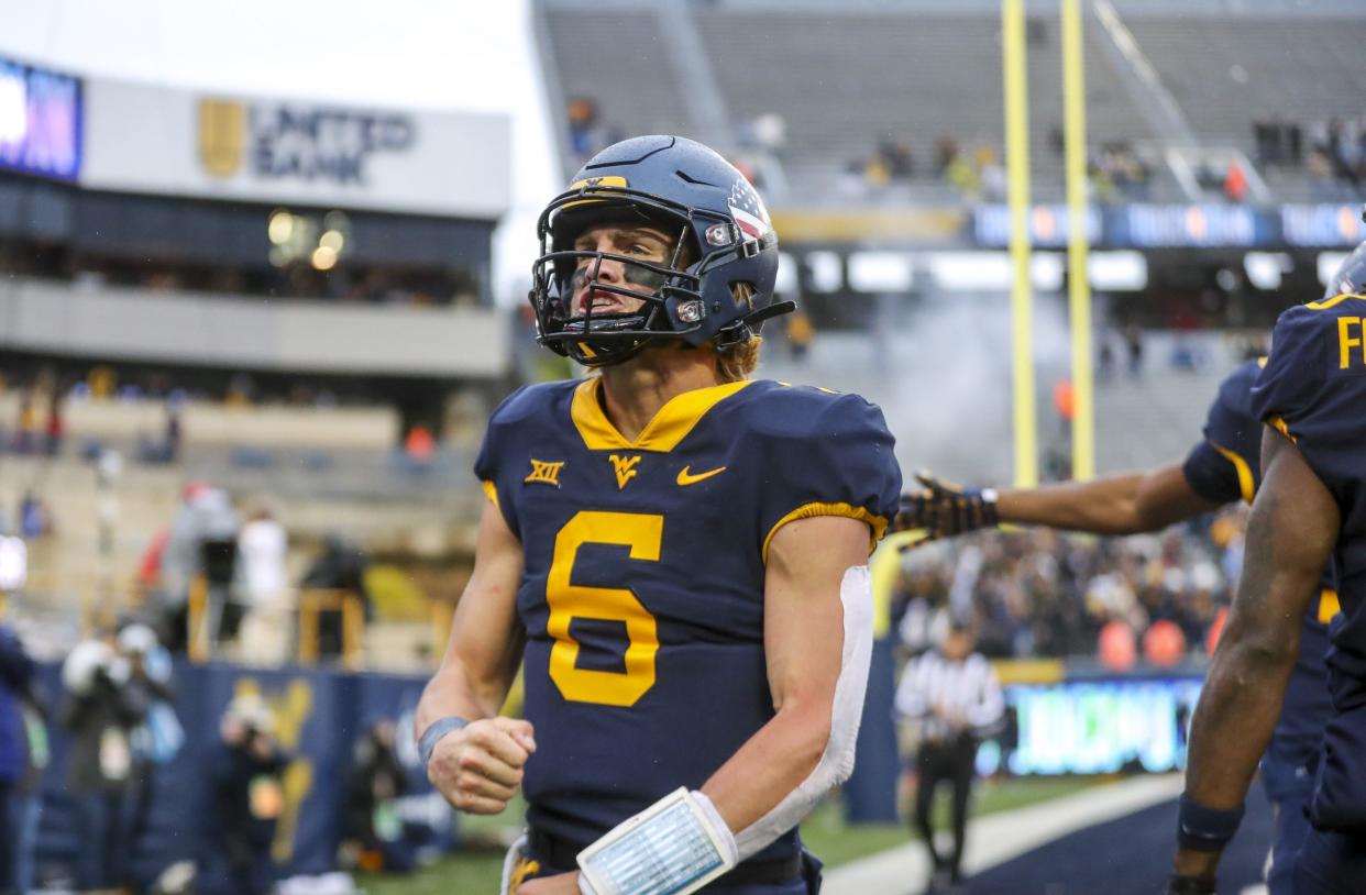 Nov 12, 2022; Morgantown, West Virginia, USA; West Virginia Mountaineers quarterback Garrett Greene (6) celebrates after throwing a touchdown pass during the third quarter against the Oklahoma Sooners at Mountaineer Field at Milan Puskar Stadium. Mandatory Credit: Ben Queen-USA TODAY Sports