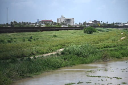 U.S. border fence near the Rio Grande is pictured from the Mexican side of the Brownsville-Matamoros International Bridge