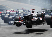 Kamui Kobayashi of Japan and Sauber F1 touches wheels with the spinning Romain Grosjean (out of frame) of France and Lotus at the start of the Monaco Formula One Grand Prix at the Circuit de Monaco on May 27, 2012 in Monte Carlo, Monaco. (Mark Thompson/Getty Images)