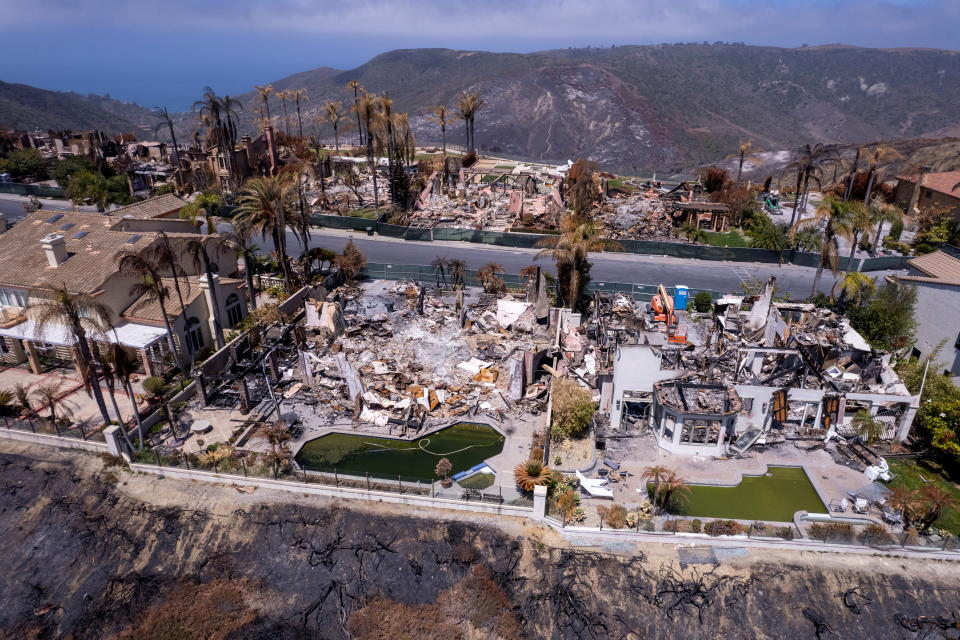 The damage to a neighborhood and its multi-million dollar homes is show three-weeks after a wind-driven wildfire burned through a canyon May 11 and into their neighborhood in Laguna Niguel, California , U.S., June 1, 2022. Picture taken with a drone.      REUTERS/Mike Blake