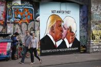 A mural of Donald Trump embracing Boris Johnson is seen on a building in Bristol, Britain May 24, 2016. REUTERS/Peter Nicholls