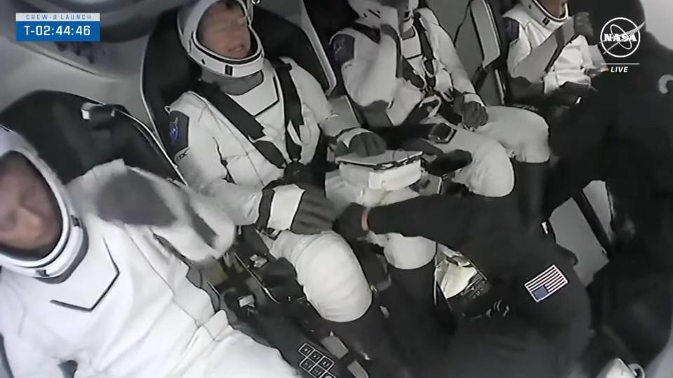 The four astronauts of SpaceX's Crew-8 mission sit aboard their Crew Dragon capsule Endeavour ahead of their planned March 3, 2024 launch. 