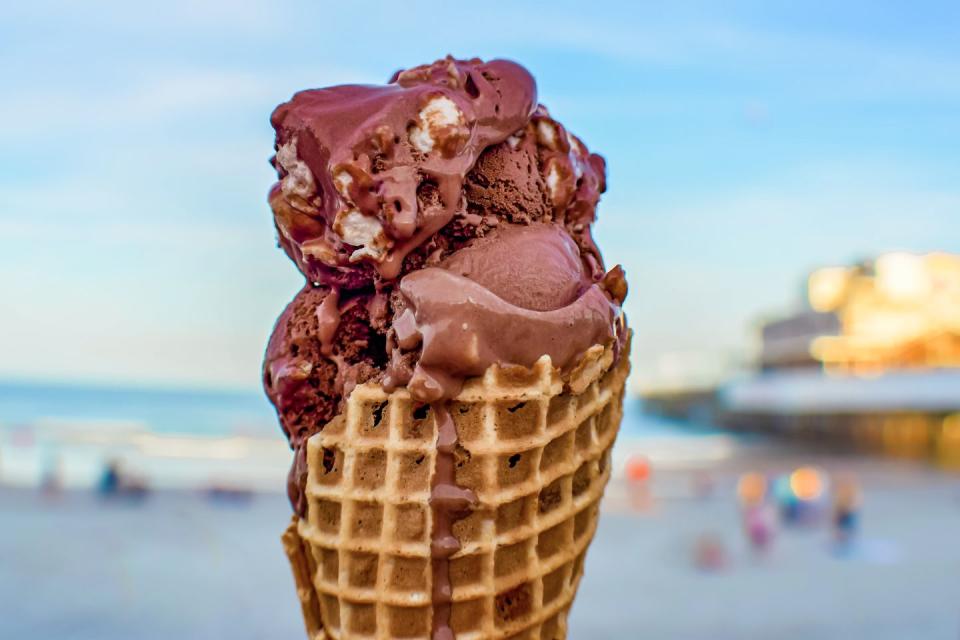 chocolate ice cream cone on beach