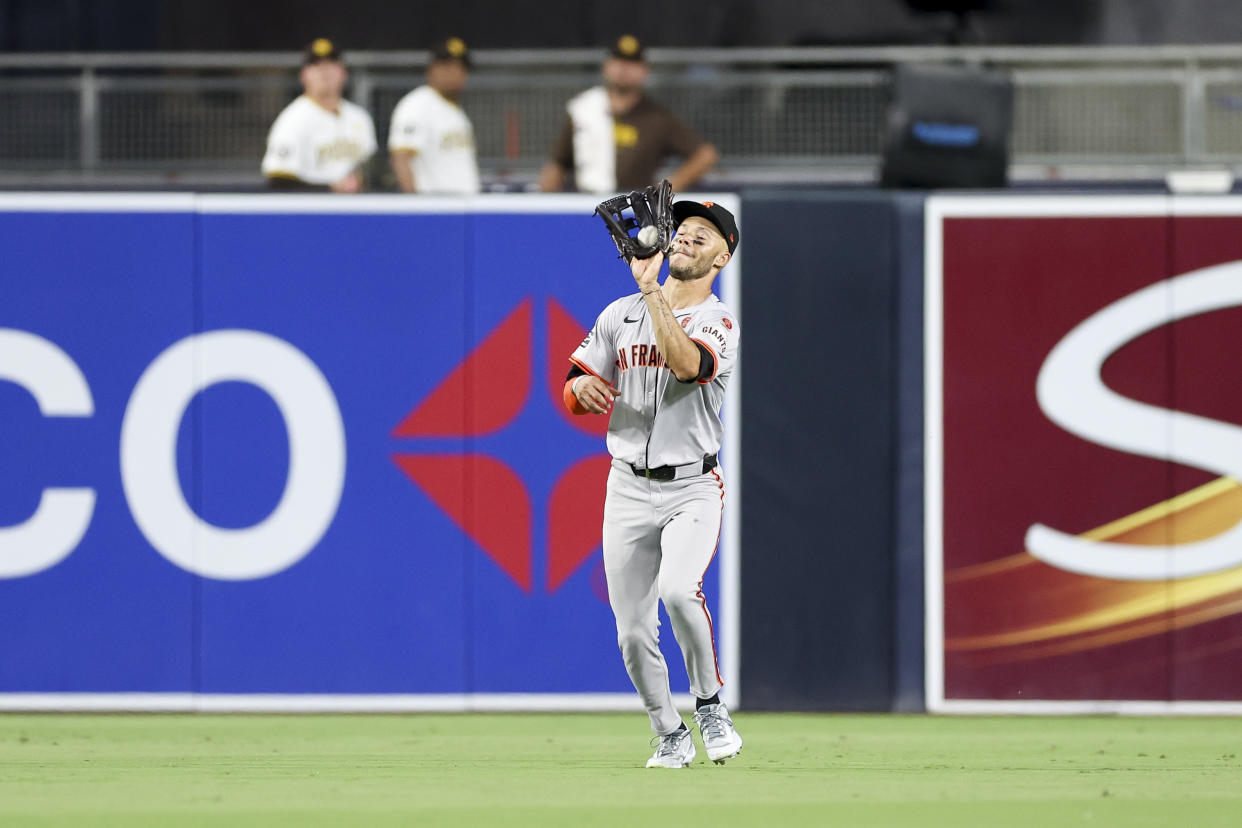 San Francisco Giants center fielder Grant McCray catches a flyout by San Diego Padres' Luis Campusano during the sixth inning of a baseball game Saturday, Sept. 7, 2024, in San Diego. (AP Photo/Ryan Sun)