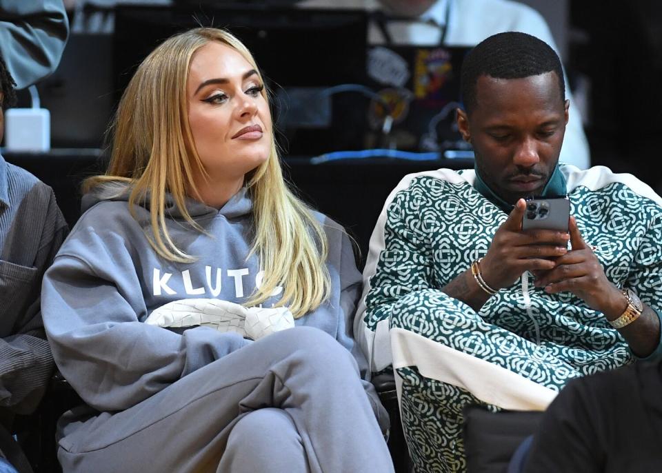 Singer Adele attends a basketball game.