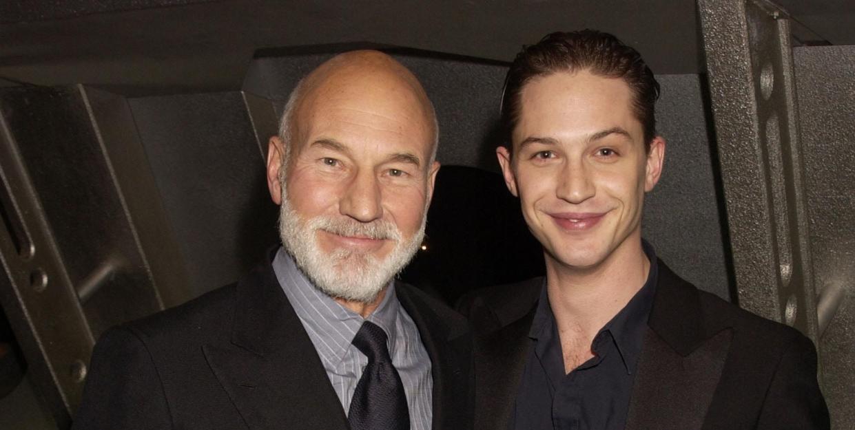 patrick stewart and tom hardy smile on the red carpet at a star trek movie premiere in 2002