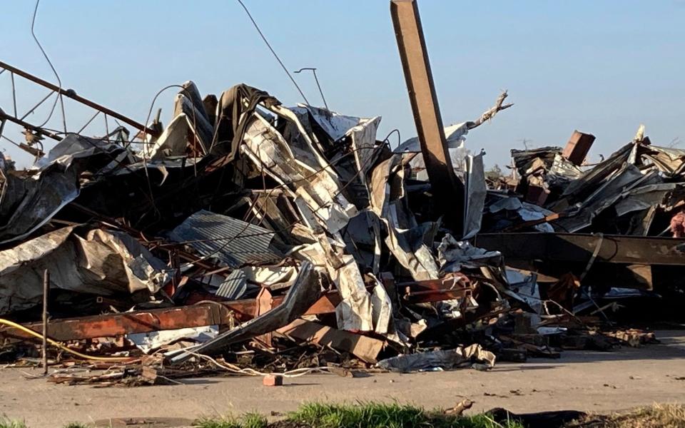 Debris covers a damaged structure in Rolling Fork, Miss - AP