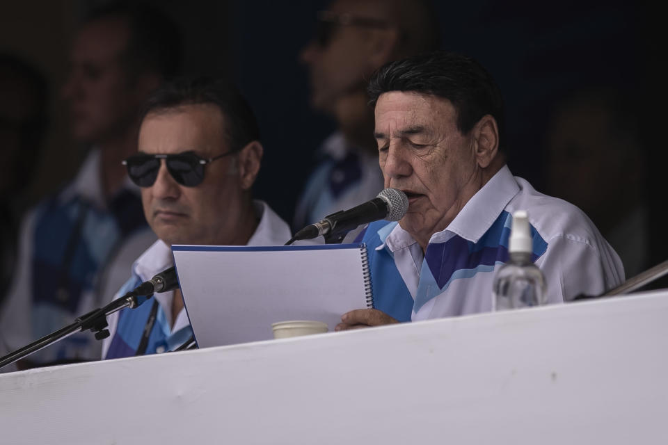 Jorge Perlingeiro, president of the Independent League of Samba Schools in Rio de Janeiro, reads the vote count that defined the champion samba school of this year's carnival, at the Sambadrome in Rio de Janeiro, Brazil, Wednesday, Feb. 22, 2023. (AP Photo/Bruna Prado)