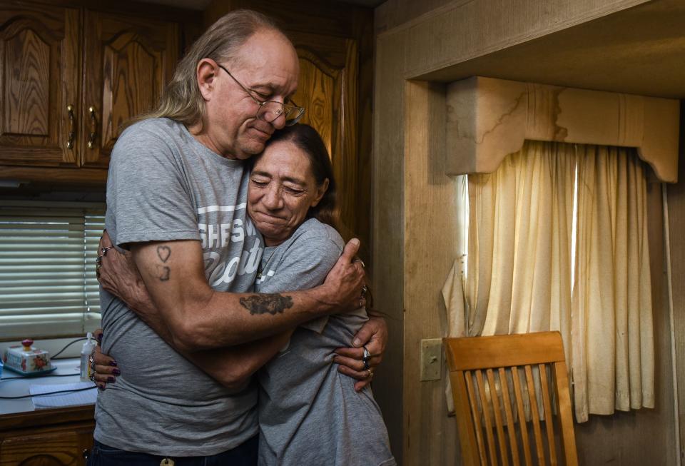 Life-long "carnies" Stephen and Tina Stimpson of Bangor, Maine hug Sunday, July 17, 2022, in their fifth-wheel trailer parked at the Barry County Expo Center fairgrounds in Hastings, Mich. They met in 1980 working a carnival and are the eldest of three-generations of carnival workers.