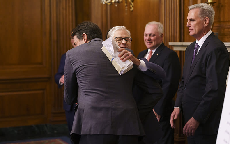Rep. Garret Graves (R-La.) hugs Rep. Patrick McHenry (R-N.C.). during a May 31 press conference