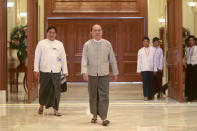 FILE PHOTO: Myanmar's President Thein Sein walks out from his first news conference since his reappointment as head of the ruling party Union Solidarity and Development Party (USDP), at the presidential palace in Naypyitaw October 21, 2012. REUTERS/Soe Zeya Tun/File Photo