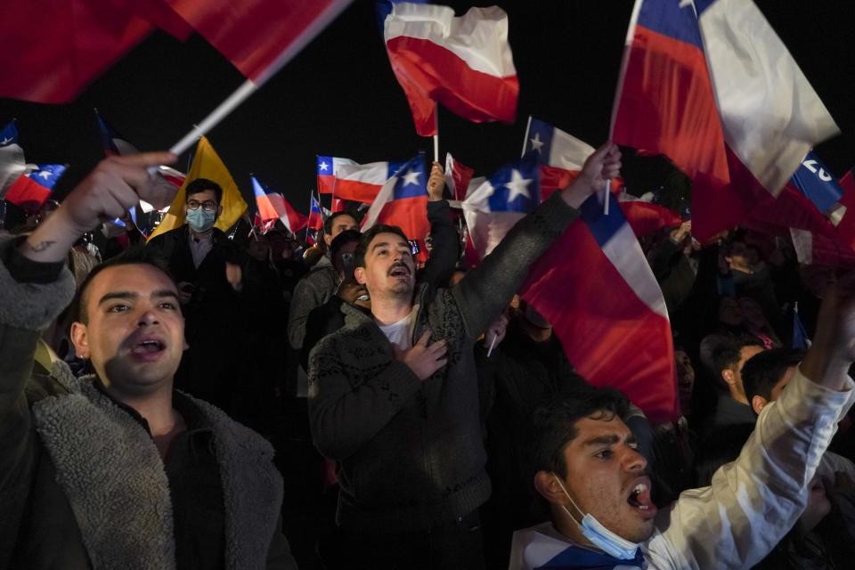 Demonstrators rally against the proposed new Constitution in Santiago, Chile, Thursday, Sept. 1, 2022. Chileans have until the Sept. 4 plebiscite to study the new draft and decide if it will replace the current Magna Carta imposed by a military dictatorship 41 years ago. (AP Photo/Matias Basualdo)