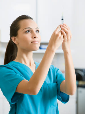 woman giving vaccines