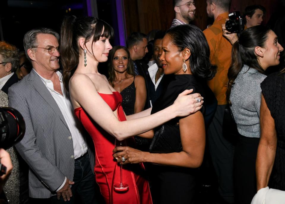Robinne Lee and Anne Hathaway hug at the premiere of 'The Idea of You'