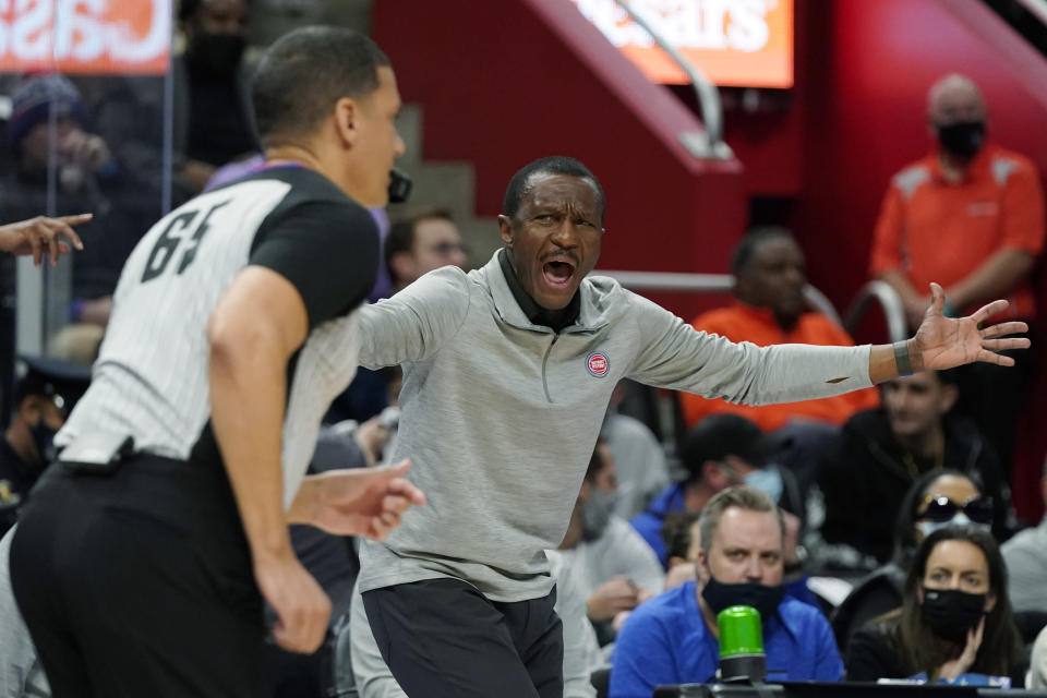 Detroit Pistons head coach Dwane Casey yells at referee Nate Green during the first half of an NBA basketball game against the Golden State Warriors, Friday, Nov. 19, 2021, in Detroit. (AP Photo/Carlos Osorio)