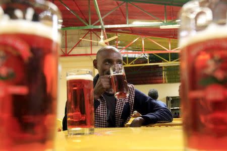 A customer drinks beer at the St. George brewery's public pub in Ethiopia's capital Addis Ababa, March 28, 2015. REUTERS/Tiksa Negeri