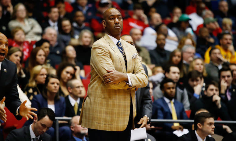 Danny Manning with his arms crossed on the sideline.