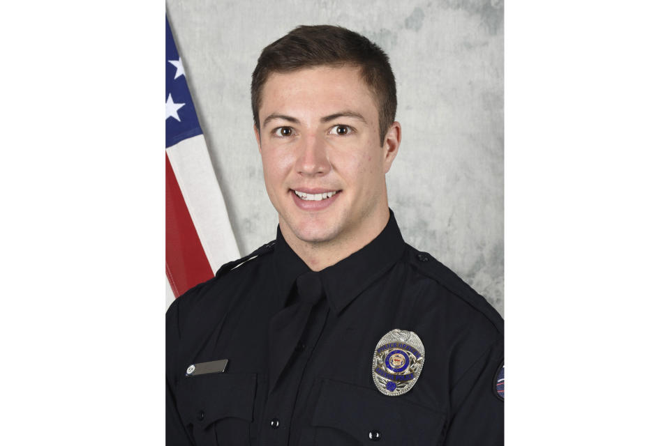 This undated photo released by the Arvada Police Department shows officer Dillon Vakoff, who died at a hospital Sunday, Sept. 11, 2022, after being shot while he and another officer responded to a large family disturbance that spilled into a street outside a housing complex, in Arvada, Colo. Vakoff was the second officer to be slain in the line of duty in as many years in Arvada, a city located 7 miles (11 kilometers) northwest of downtown Denver. (Arvada Police Department via AP)