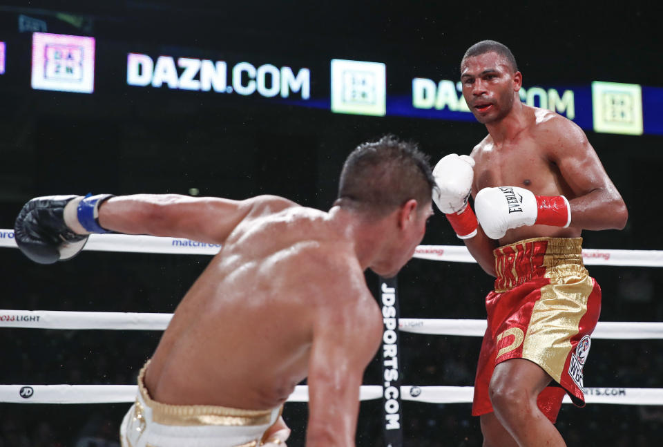 Thomas Dulorme, right, knocks down Jessie Vargas during a boxing bout Saturday, Oct. 6, 2018, in Chicago. (AP Photo/Kamil Krzaczynski)