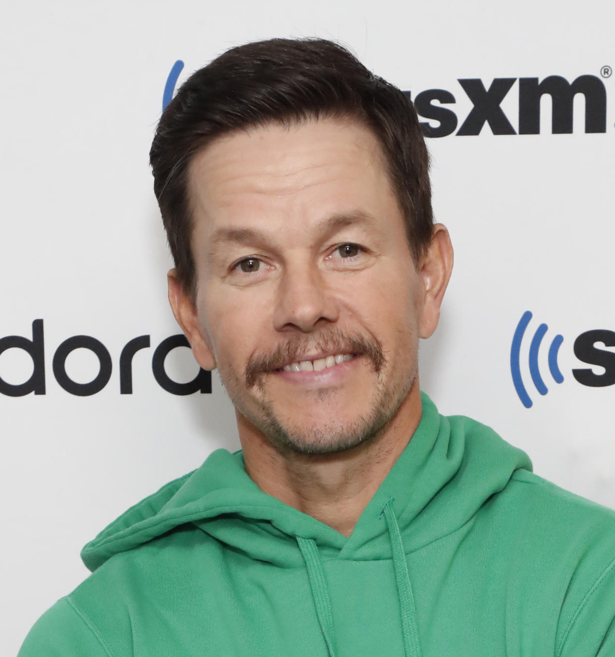 Actor Mark Wahlberg, 50, revealed he wakes up at 2:30 a.m. and is in bed by 7:30 p.m. It's all part of his intense daily wellness routine, which includes workouts and lots of prayer. (Photo: Astrid Stawiarz/Getty Images for SiriusXM)