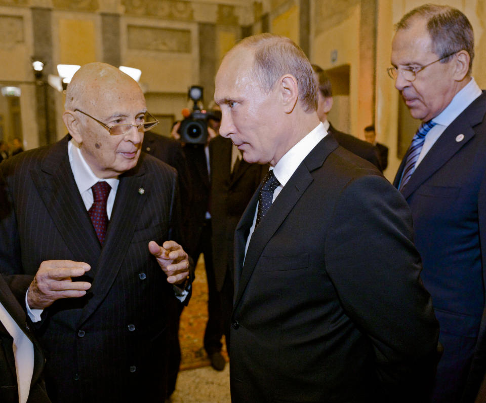 FILE - In this photo taken late Thursday, Oct. 16, 2014, Italian President Giorgio Napolitano, left, speaks to Russian President Vladimir Putin, center, as Russian Foreign Minister Sergey Lavrov, right, looks on prior to the 10th Asia-Europe Meeting (ASEM) in Milan, northern Italy. Giorgio Napolitano, the first former Communist to rise to Italy’s top job — president of the Republic — and the first president to be re-elected, has died Friday, Sept. 22, 2023. He was 98. (AP Photo/RIA-Novosti, Alexei Nikolsky, Presidential Press Service, File)