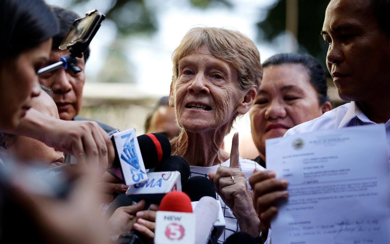 Australian missionary Sister Patricia Fox is interviewed by reporters after she was released from custody at the Bureau of Immigration in Manila, Philppines on Tuesday, April 17  - AP