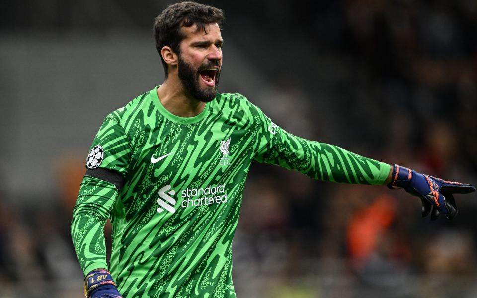 Alisson Becker shouts during Liverpool's match with AC Milan