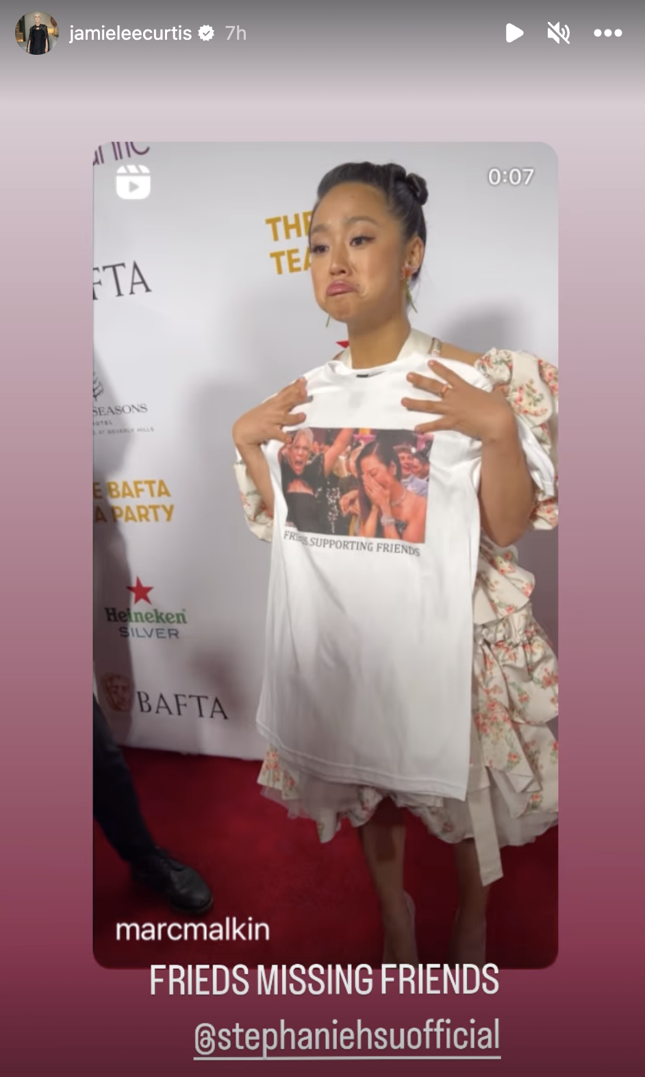 Stephanie Hsu holds up a T-shirt. (@jamieleecurtis on Instagram)