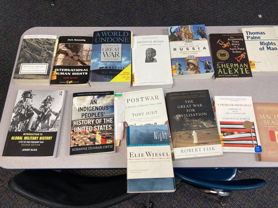 A collection of the books Lauren Reed uses to teach history at Grand Ledge High School