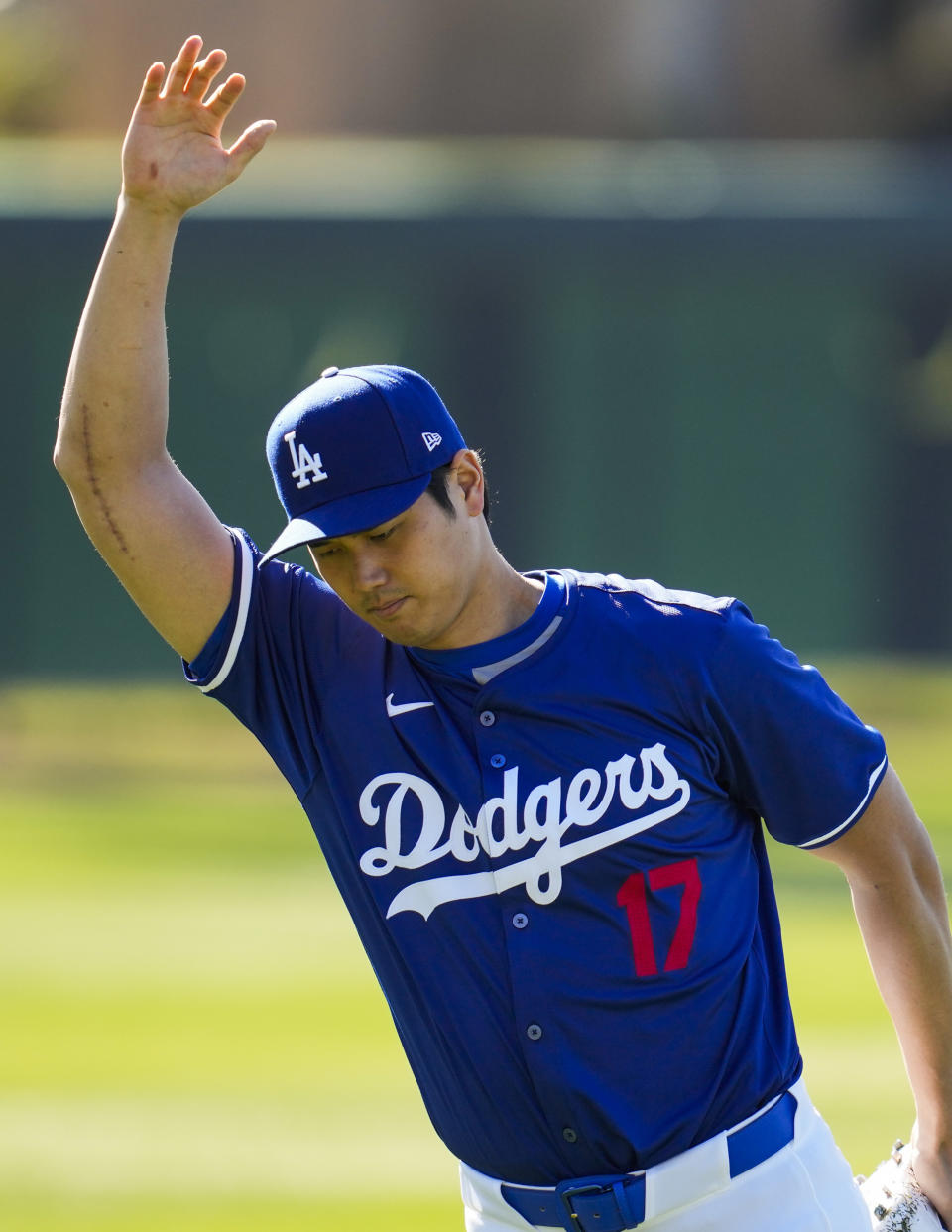 FILE - Los Angeles Dodgers designated hitter Shohei Ohtani participates in spring training baseball workouts at Camelback Ranch in Phoenix, Wednesday, Feb. 14, 2024. Ohtani has dodged questions about his second elbow surgery. (AP Photo/Ashley Landis, File)