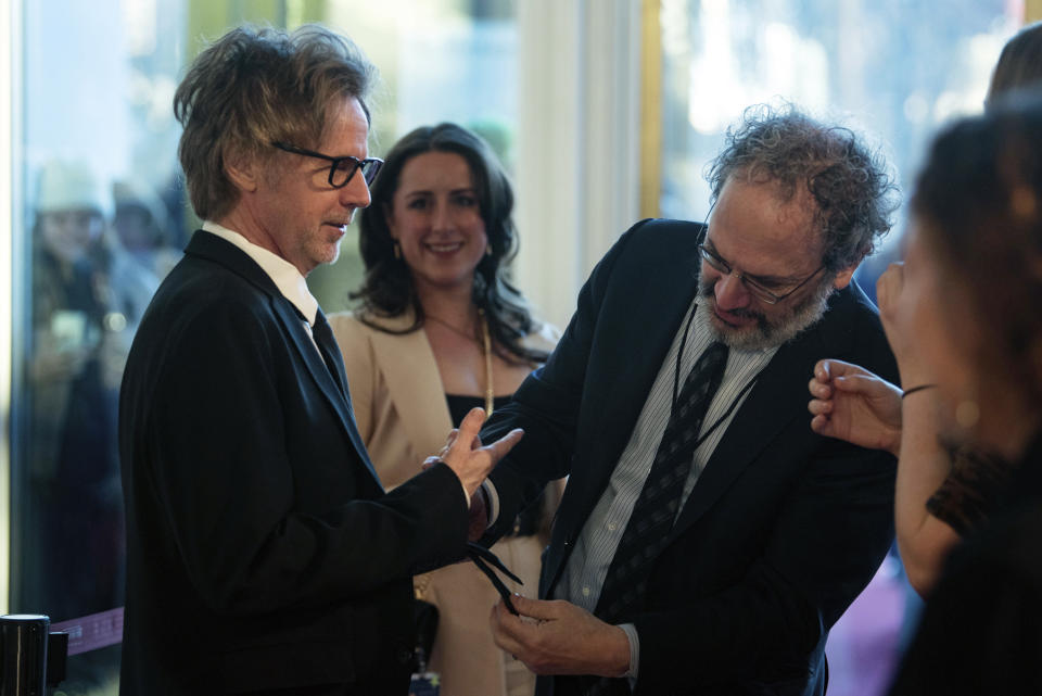 Dana Carvey, left, has his tie inspected by Robert Smigel before walking the red carpet for the 24th Annual Mark Twain Prize for American Humor at the Kennedy Center for the Performing Arts, Sunday, March 19, 2023, in Washington. (AP Photo/Kevin Wolf)