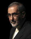 In this Jan. 30, 2020, photo, Ali Akbar Velayati, adviser to the Iranian supreme leader Ayatollah Ali Khamenei, gives a press conference, in Tehran, Iran. In hard-hit Iran, state-run TV announced that Velayati was quarantined at home after testing positive for the virus. He is a close, trusted adviser to the 80-year-old leader of the Islamic Republic, who was recently seen wearing disposable gloves at a tree-planting ceremony, apparently out of caution about the virus. (AP Photo/Vahid Salemi)