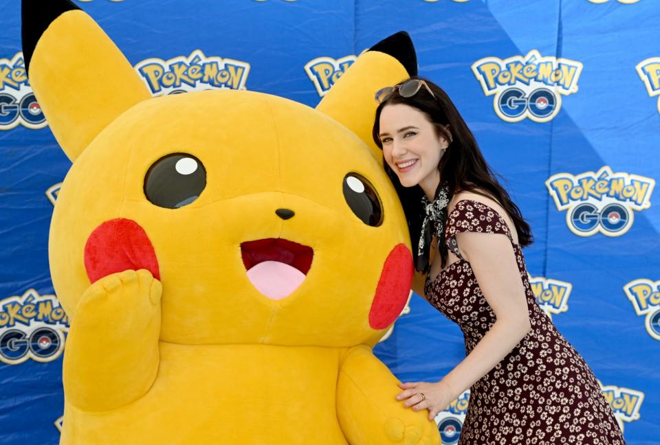 NEW YORK, NEW YORK - JULY 06: Rachel Brosnahan poses with Pikachu at Pokémon GO Fest 2024: New York City at Randall’s Island Park on July 06, 2024 in New York City. (Photo by Dave Kotinsky/Getty Images for Niantic)