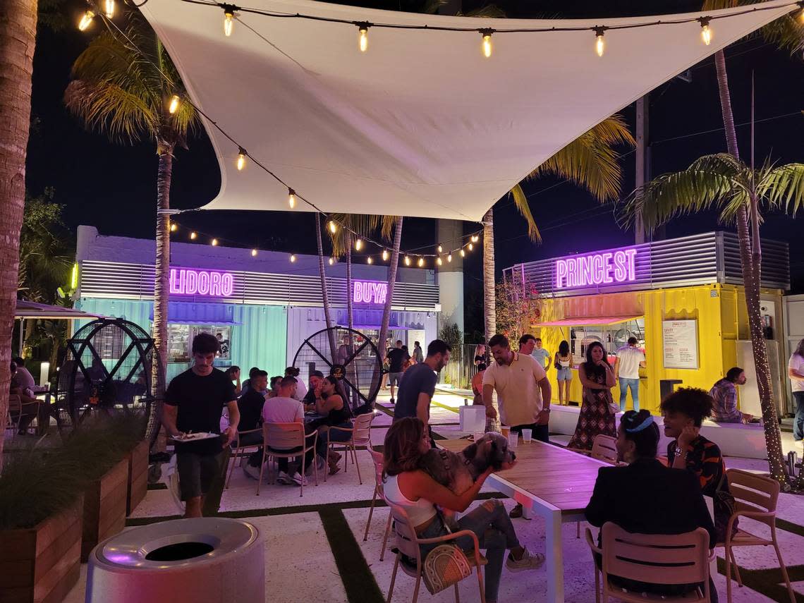 Fans keep the breeze going at The Oasis in Wynwood while diners enjoy dinner.