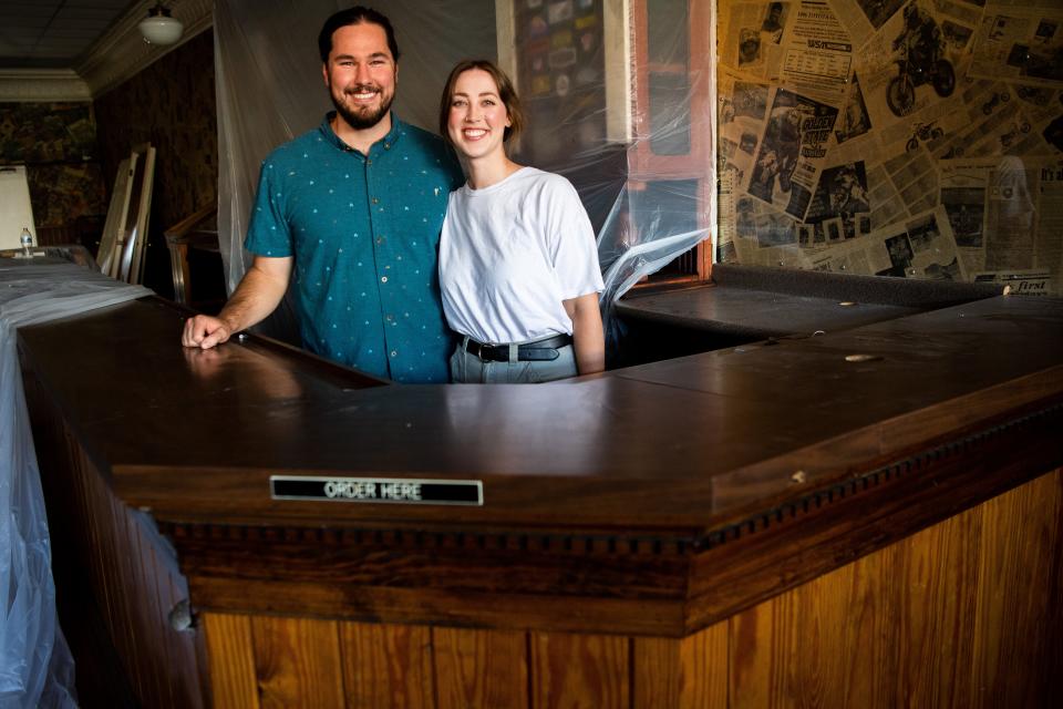 Zach and Alexis Hill are photographed with the former Time Warp Team Room bar that will move next door to Zero/Zero, the couple's forthcoming natural wine bar in the Happy Holler neighborhood.