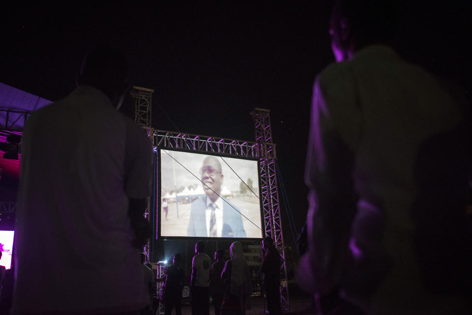 People watch the documentary Ahmed Hussein-Suale helped make that uncovered corruption in soccer. (AFP/Getty Images)