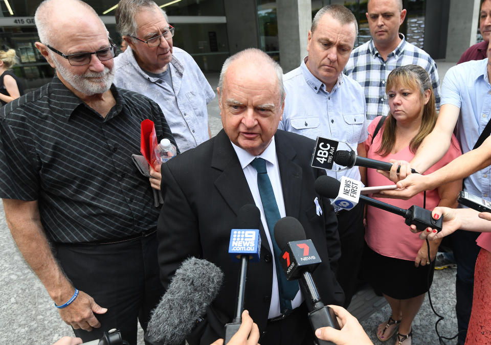Jon Knowles (centre), father of murder victim Patricia Riggs, is seen talking to the media outside the Brisbane Supreme Court. Source: AAP