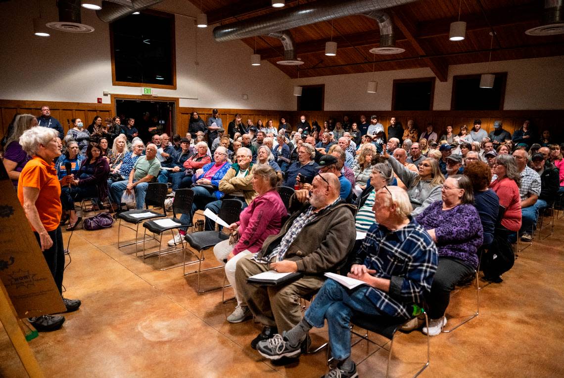 Dr. Shannon West, a Graham veterinarian, speaks to a crowd of about 125 people about the impacts a new airport would have on their community and actions they can take to prevent it from being built there, at a meeting at Frontier Park in Graham, on Oct. 17, 2022.