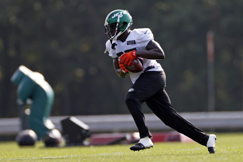 FILE - In this Aug. 25, 2020, file photo, New York Jets running back Frank Gore runs with the ball during a practice at the NFL football team's training camp in Florham Park, N.J. Gore took his first NFL snaps as a pro with the San Francisco 49ers in 2005 in what seems like a lifetime ago for the NFL’s third-leading rusher. It all comes full circle for the 37-year-old Gore on Sunday, Sept. 20, 2020, when his Jets host the team with which he began his career 16 years ago. (AP Photo/Adam Hunger, File)