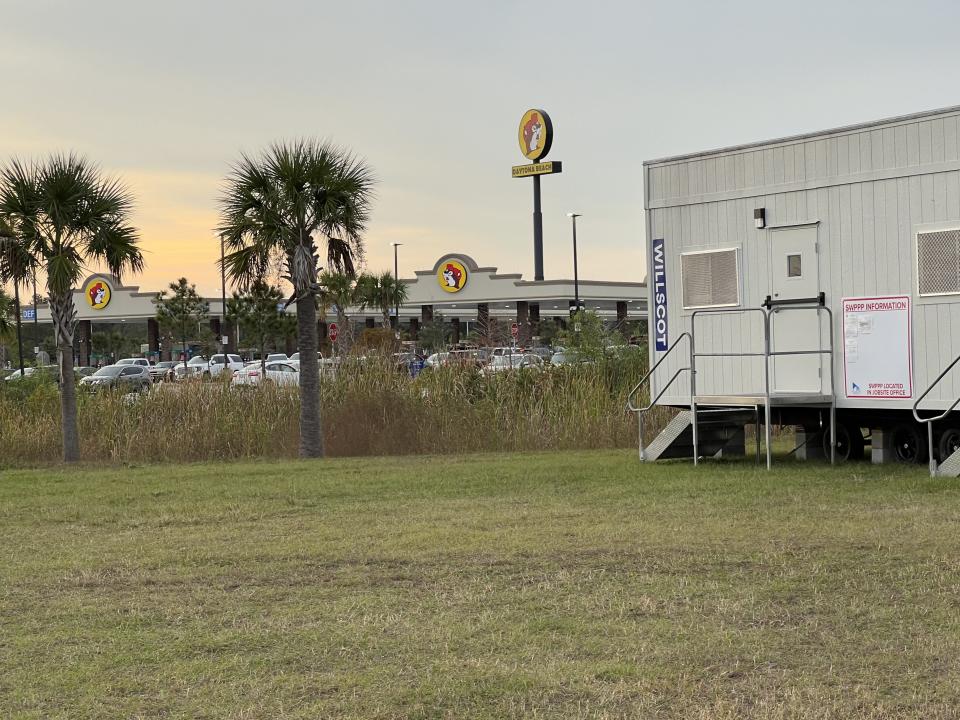 A construction trailer for J. Raymond Construction can be seen in front of the Buc-ee's gas station/travel convenience center next to the Interstate 95/LPGA Boulevard interchange in Daytona Beach on Saturday, Dec. 2, 2023. Texas-based Buc-ee's recently began clearing land next to its Daytona Beach store to make way for a 235-foot-long Buc-ee's car wash set to open in either late summer or early fall 2024.