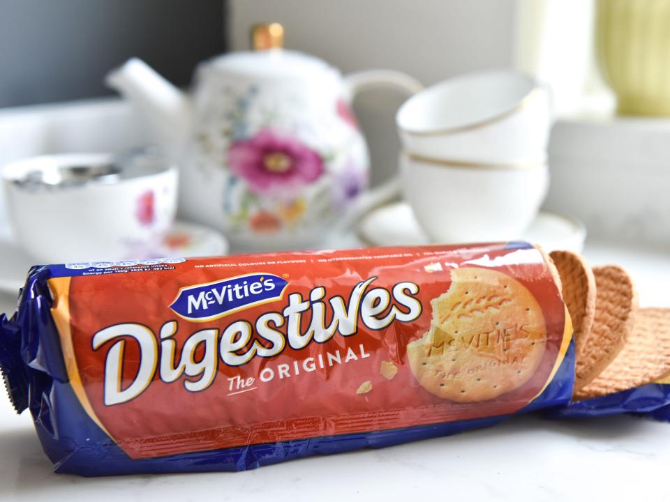 McVitie's Digestive biscuits with a teapot and cups.