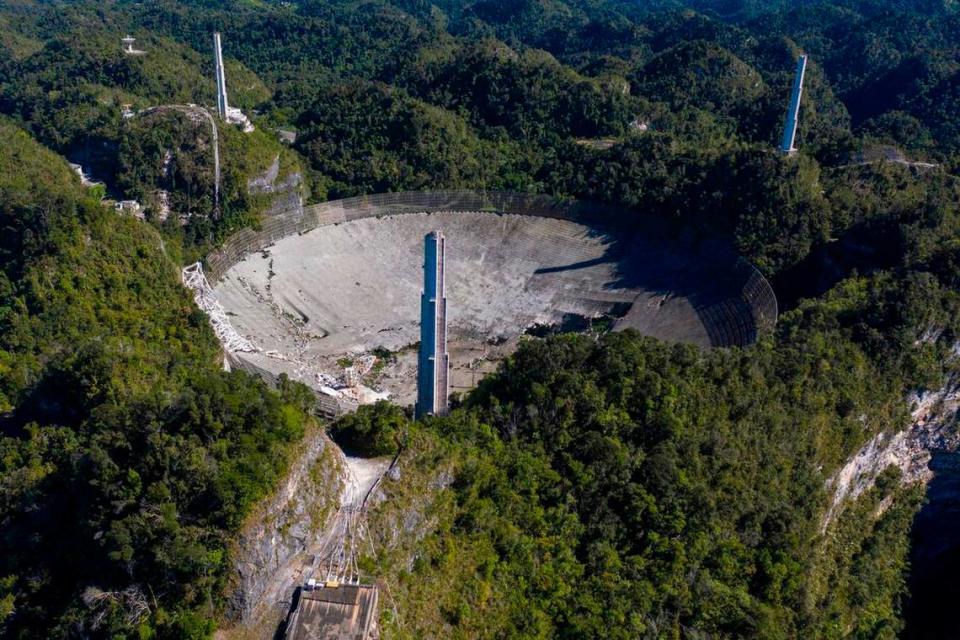 This aerial view shows the damage at the Arecibo Observatory after one of the main cables holding the receiver was broken in Arecibo, Puerto Rico, on December 1, 2020.
