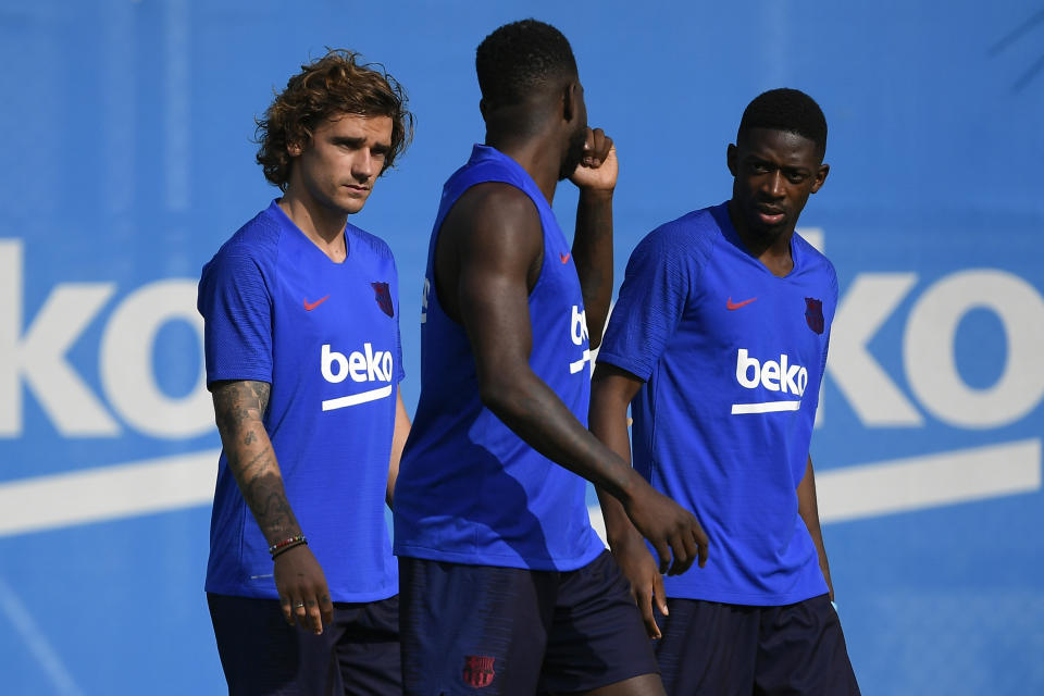 (L-R) Barcelona's French forward Antoine Griezmann, Barcelona's French defender Samuel Umtiti and Barcelona's French forward Ousmane Dembele arrive to the football club's first pre-season training session at the Joan Gamper training ground in Sant Joan Despi near Barcelona on July 15, 2019. (Photo by LLUIS GENE / AFP)        (Photo credit should read LLUIS GENE/AFP/Getty Images)