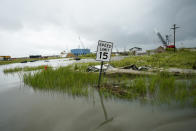 Debris sits in floodwaters Friday, Aug. 28, 2020, in Cameron, La., after Hurricane Laura moved through the area Thursday. (AP Photo/David J. Phillip)