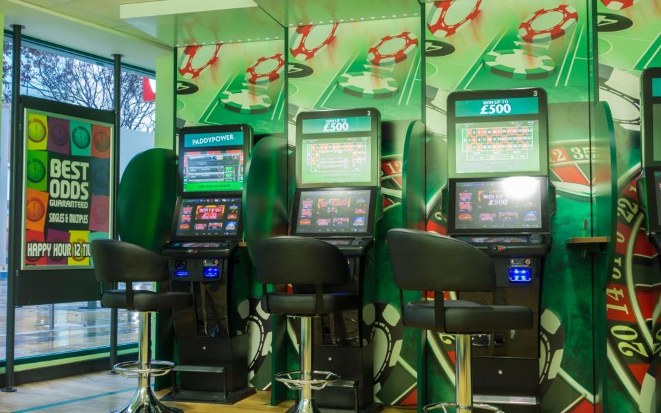 The Government said in October it would reduce the maximum stake on in-shop fixed odds betting terminals (FOBTs) to between £2 and £50  - Alamy