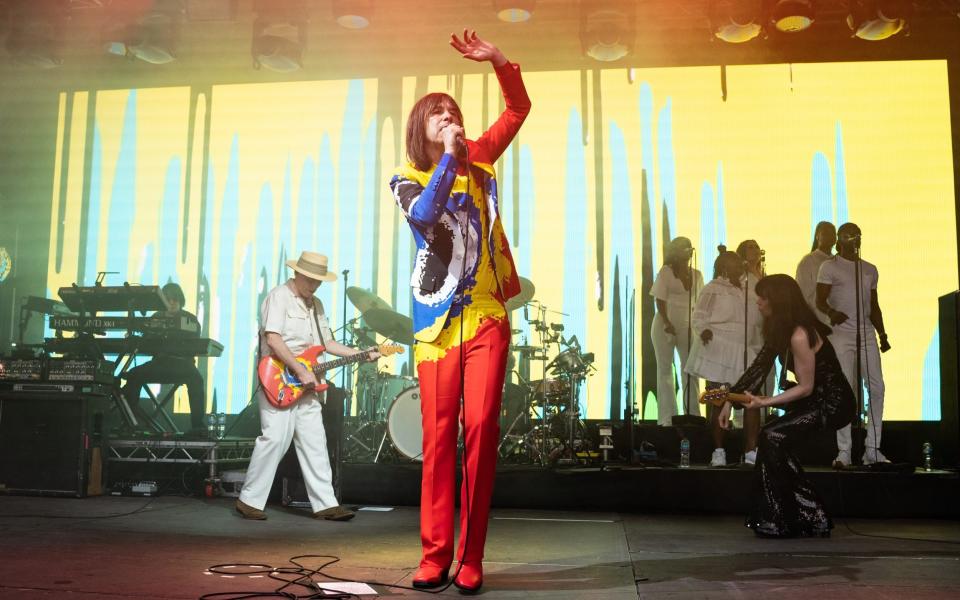 Andrew Innes, Bobby Gillespie and Simone Butler of Primal Scream perform at Alexandra Palace on July 16, 2022 in London, England - Redferns/Lorne Thomson