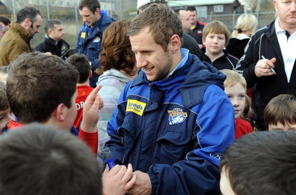 News and Star: Rob Burrow with youngsters after a training session on the Cleator Moor Astro turf pitch